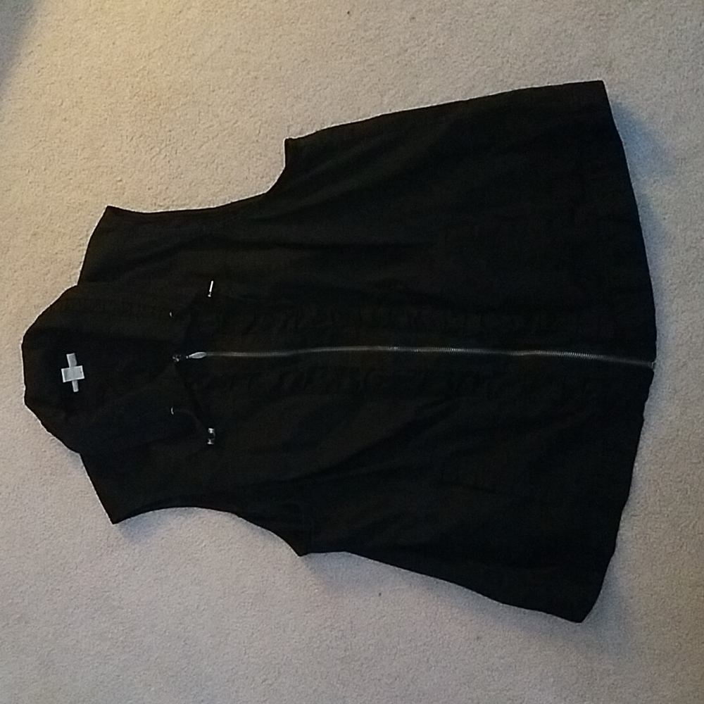 Black cotton vest w/front rouching detail, exposed zipper and side slash pocket.